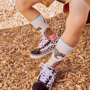 Child wearing checkered Vans sneakers