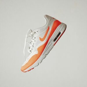 White and orange Nike sneaker
